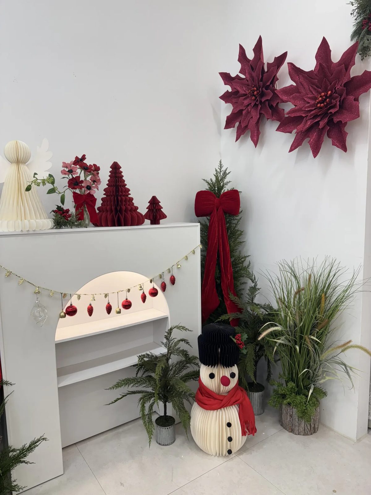 Seasonal poinsettia planterior decor styled in an interior space